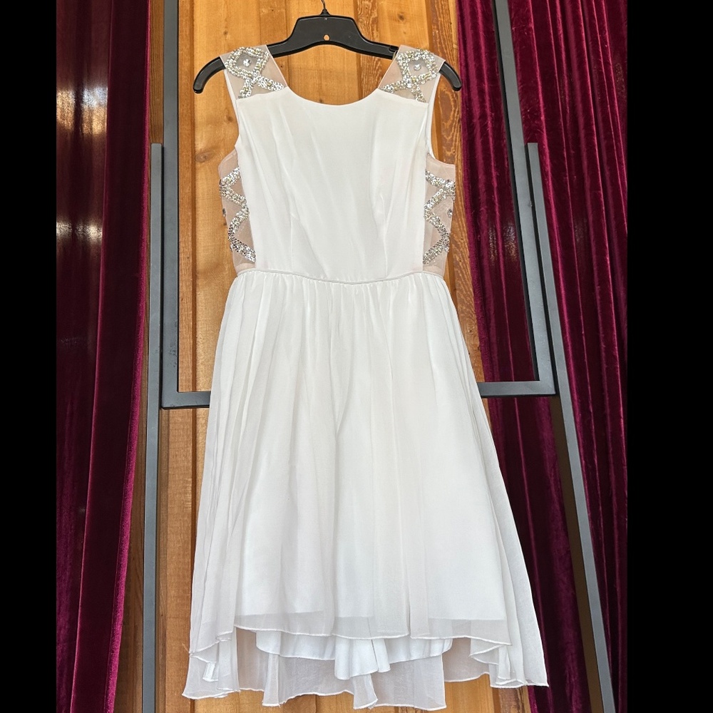 Lovely white dress with sequins and rhinestones on side